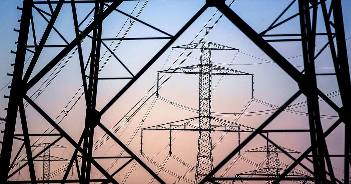 Photo of transmission towers - The Grid Capacity Crunch: Why Utilities Are Turning to Behind-the-Meter Onsite Power