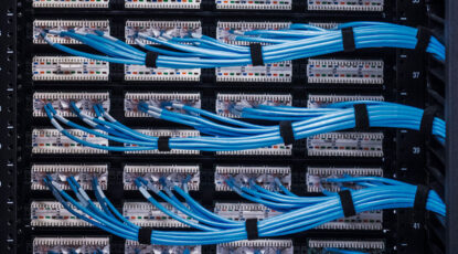 Building AI Infrastructure Takes a Village - Image of server patch cables