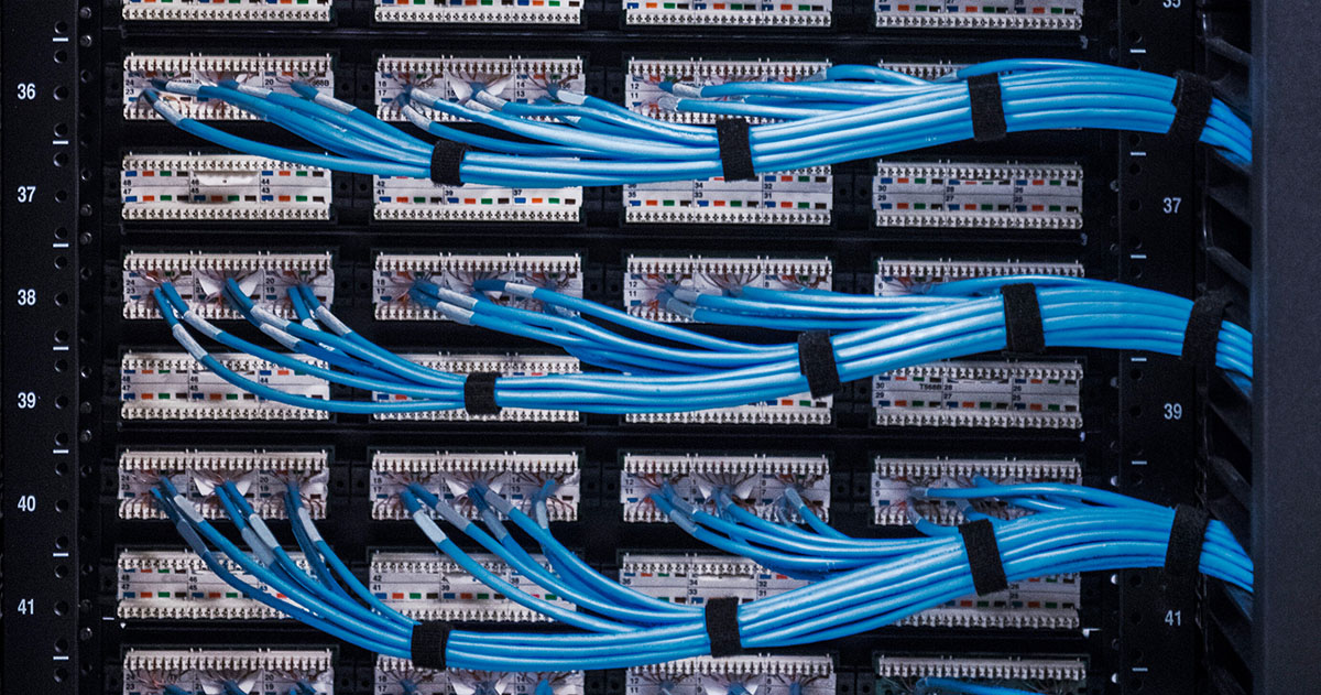 Building AI Infrastructure Takes a Village - Image of server patch cables