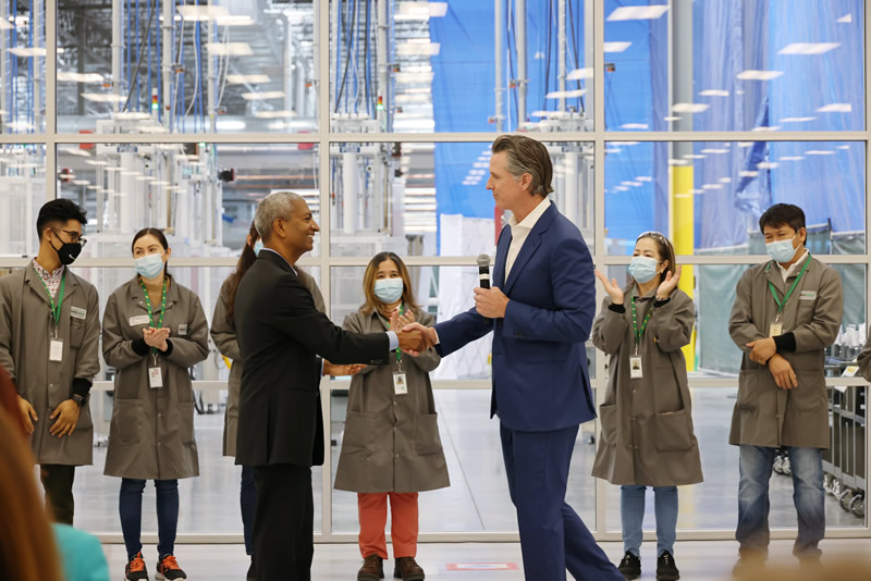 California Governor Gavin Newsom (right) and KR Sridhar, Bloom Energy Founder, Chairman and CEO, shake hands during a ribbon cutting event at the grand opening of the Fremont manufacturing plant.